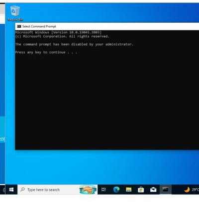 Windows 10 domain client showing Command Prompt access being restricted by Group Policy